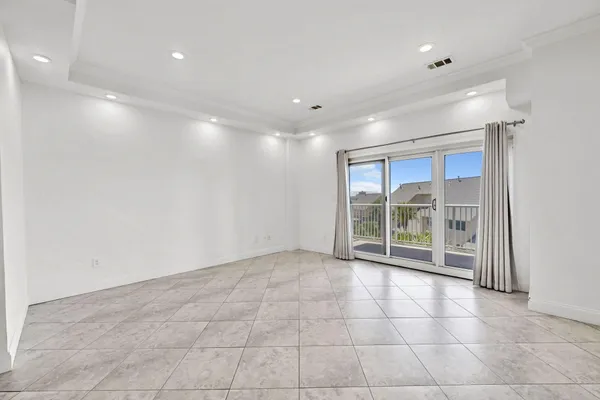 a view of an empty room with a sliding door