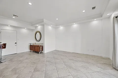 a view of a room with music instruments and windows