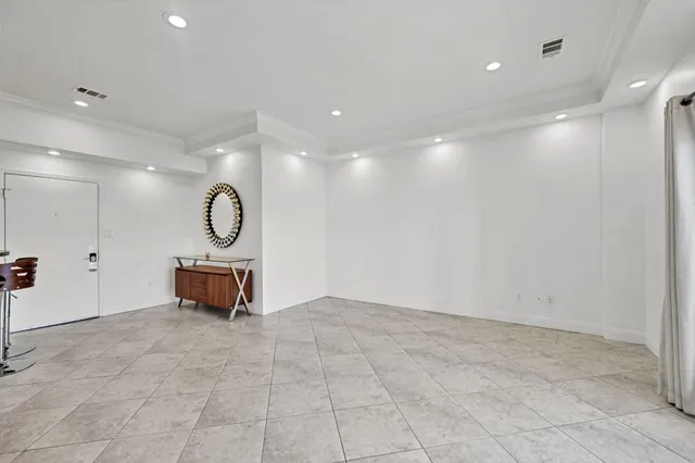 a view of a room with music instruments and windows