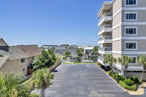 an aerial view of a house with a yard and potted plants