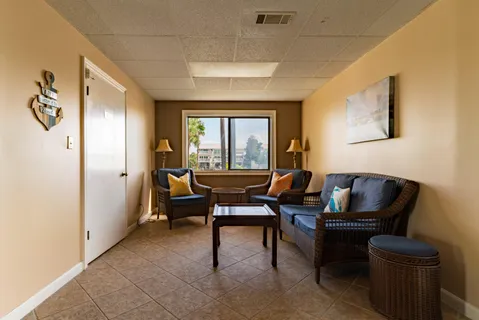 a living room with furniture and a window