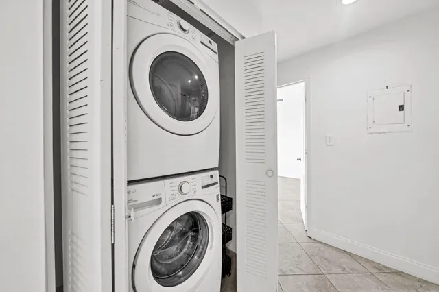 a view of a hallway with washer and dryer