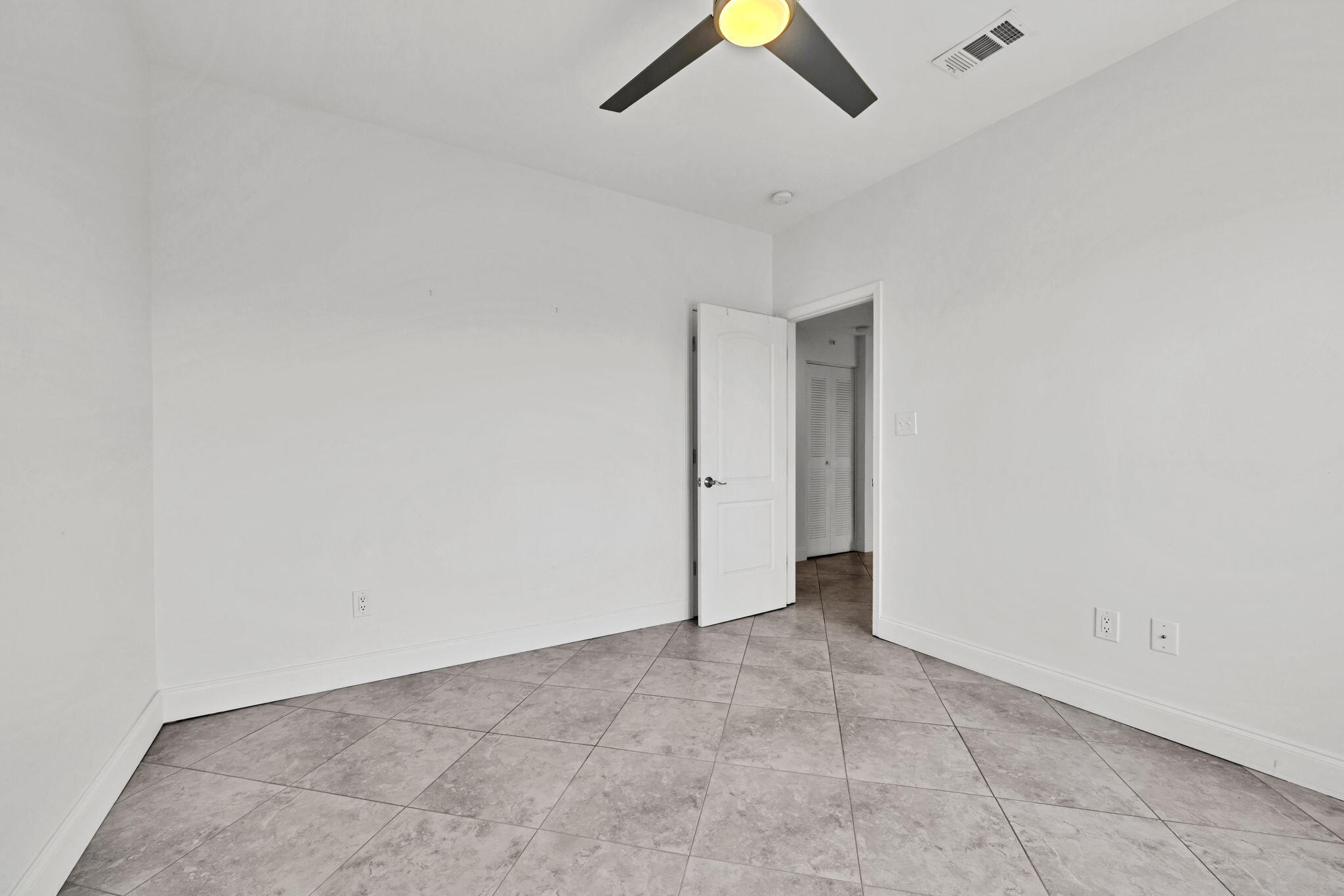 195 Durango Road, Unit 3A Destin, FL 32541 - Photo 7 of 41 an empty room with a ceiling fan and window