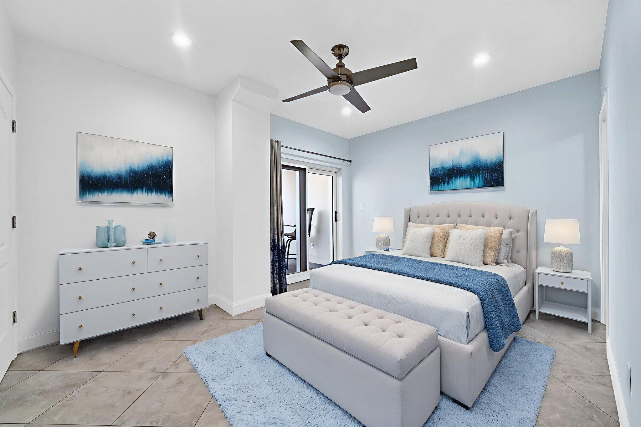 195 Durango Road, Unit 3A Destin, FL 32541 - Photo 9 of 41 a spacious bedroom with a bed and a flat screen tv