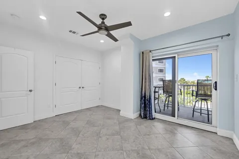 a view of an empty room and balcony