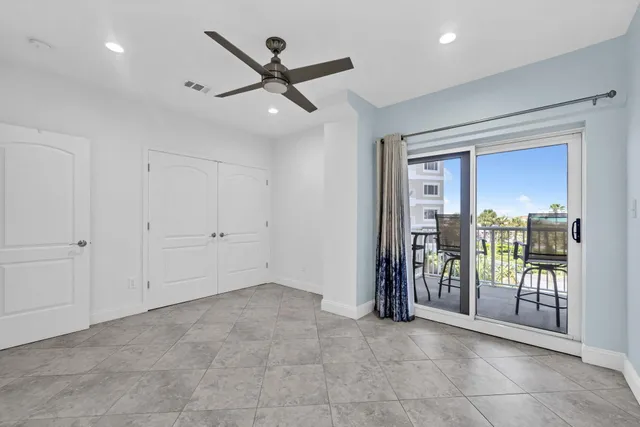 a view of an empty room and balcony