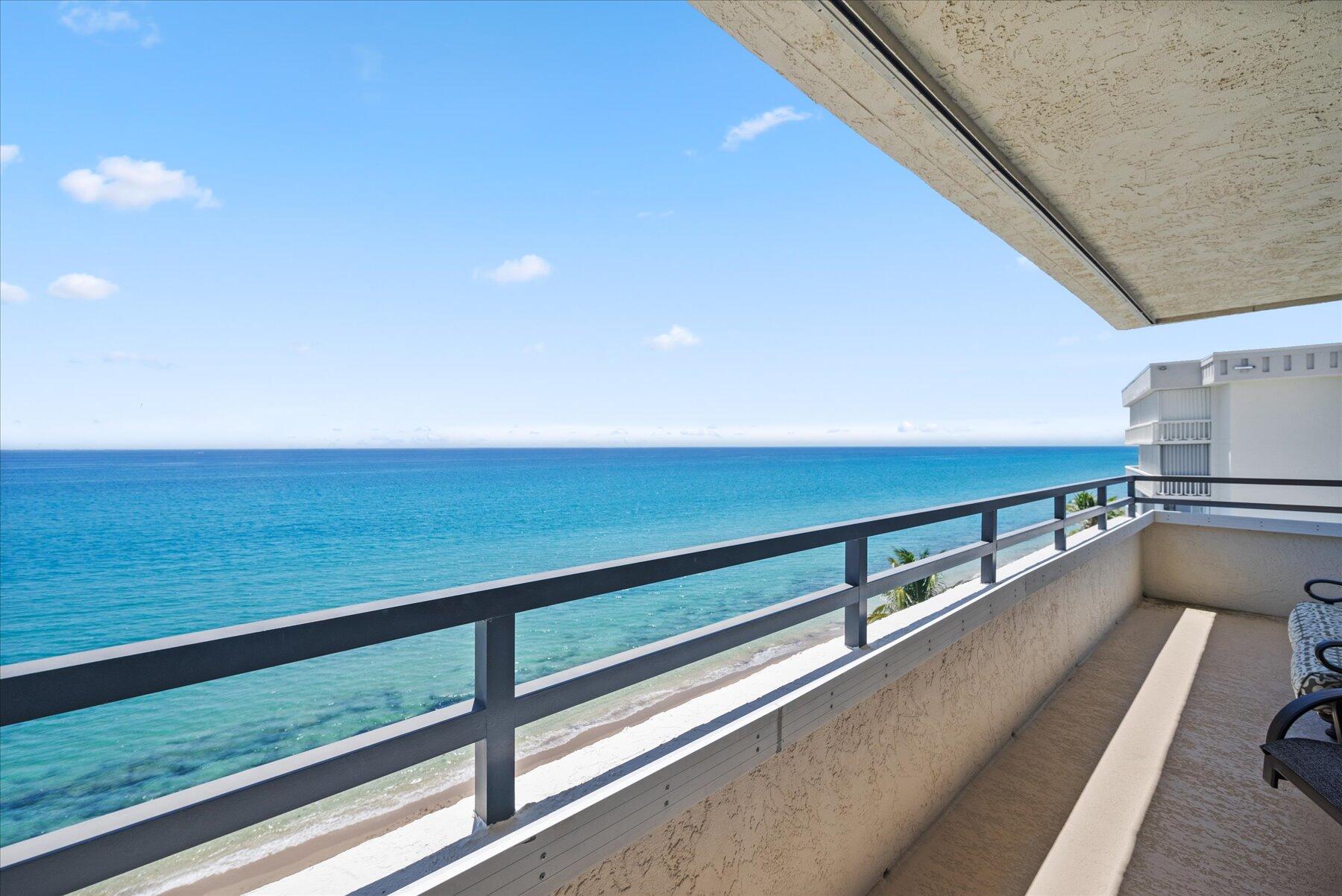 a view of a balcony with ocean view