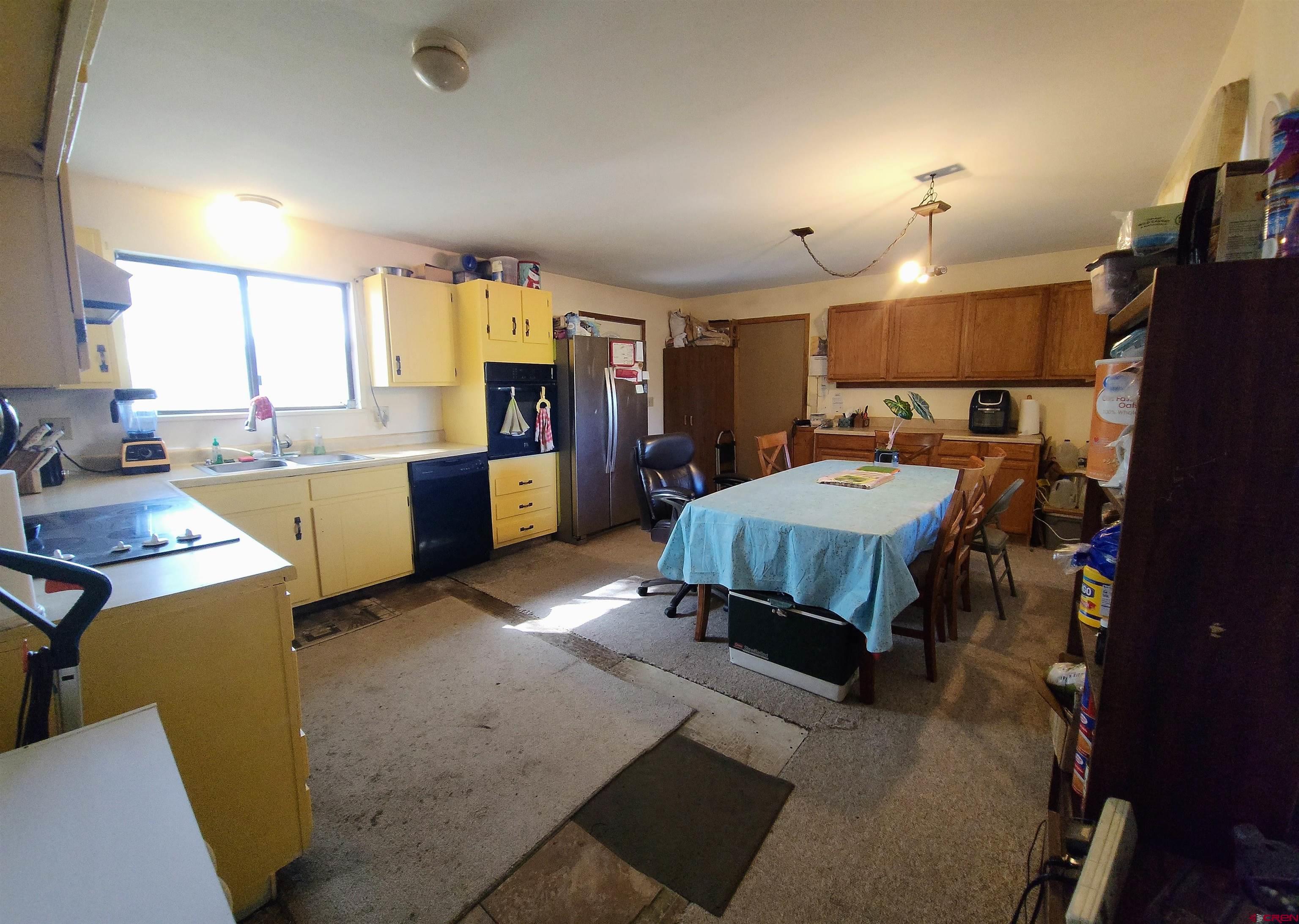17867 Surface Creek Road Cedaredge, CO 81413 - Photo 14 of 31 a bedroom with furniture and a large window