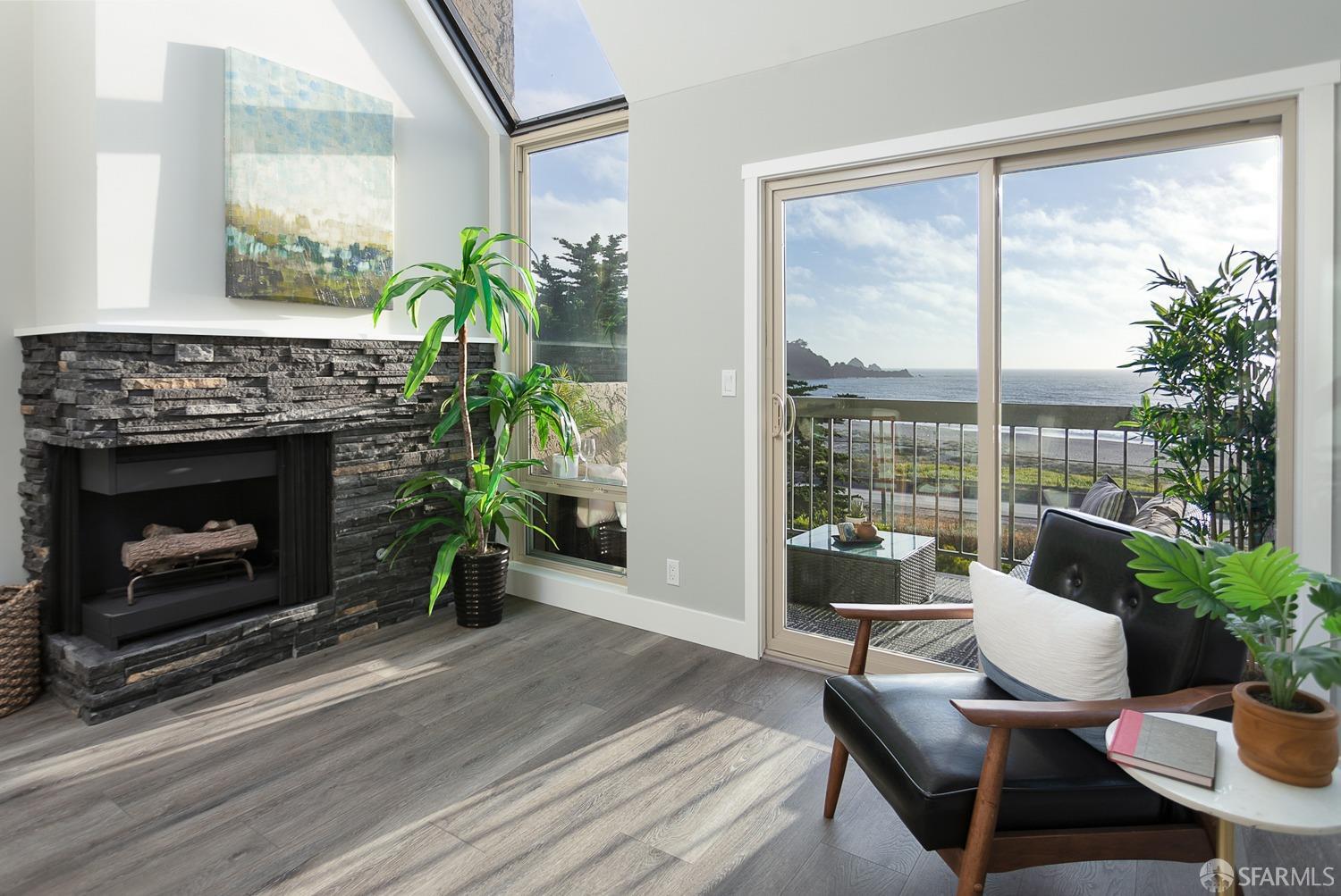 461 Roberts Road Pacifica, CA 94044 - Photo 1 of 1 a living room with furniture a large window and a fireplace