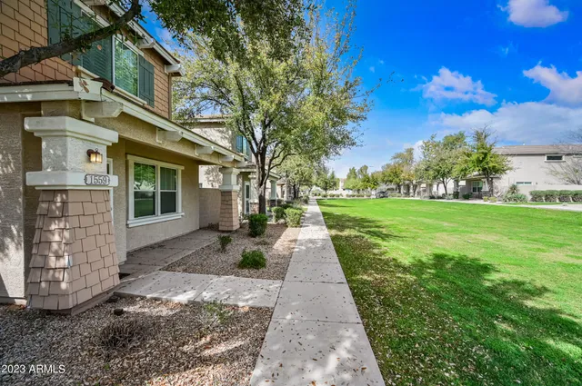 a front view of a house with yard