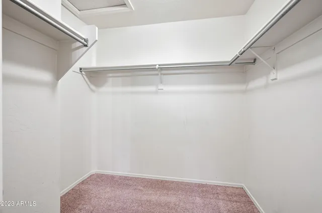 a view of an empty walk in closet