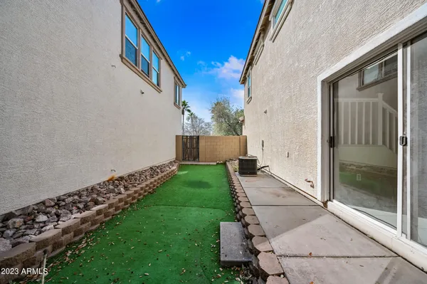 a view of house with backyard