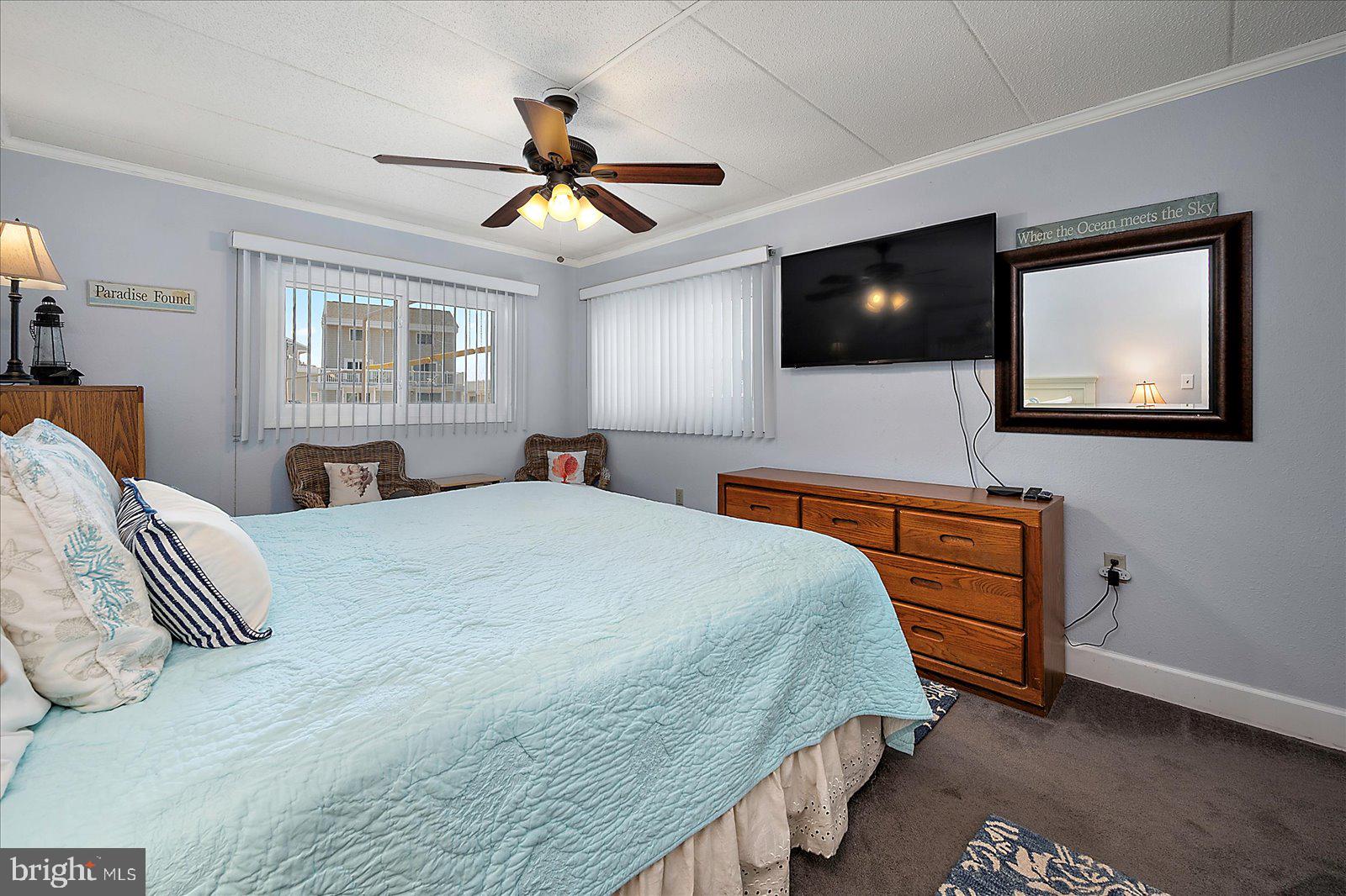 4 46th Street, Unit 101 Ocean City, MD 21842 - Photo 12 of 27 a bedroom with a bed and a flat screen tv