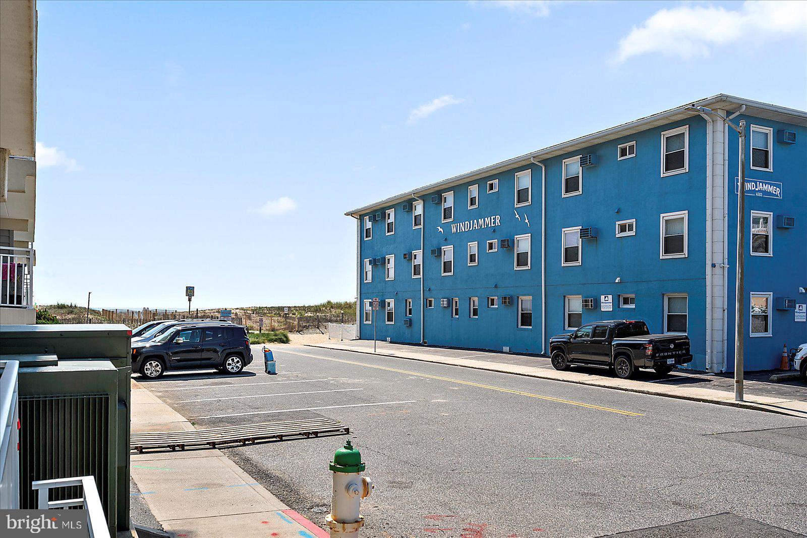 4 46th Street, Unit 101 Ocean City, MD 21842 - Photo 24 of 27 a front view of a building with cars