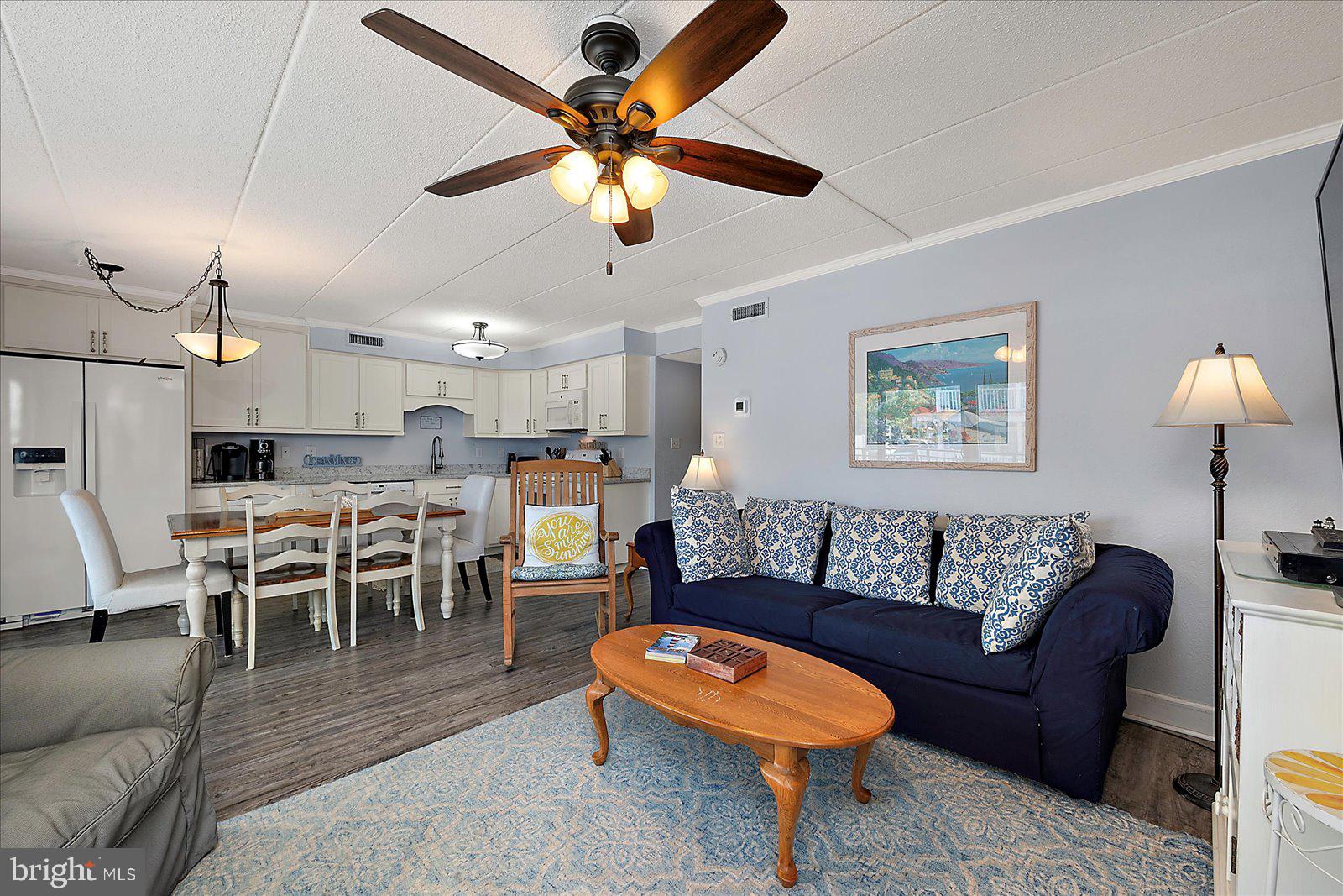 4 46th Street, Unit 101 Ocean City, MD 21842 - Photo 4 of 27 a living room with furniture kitchen and a table