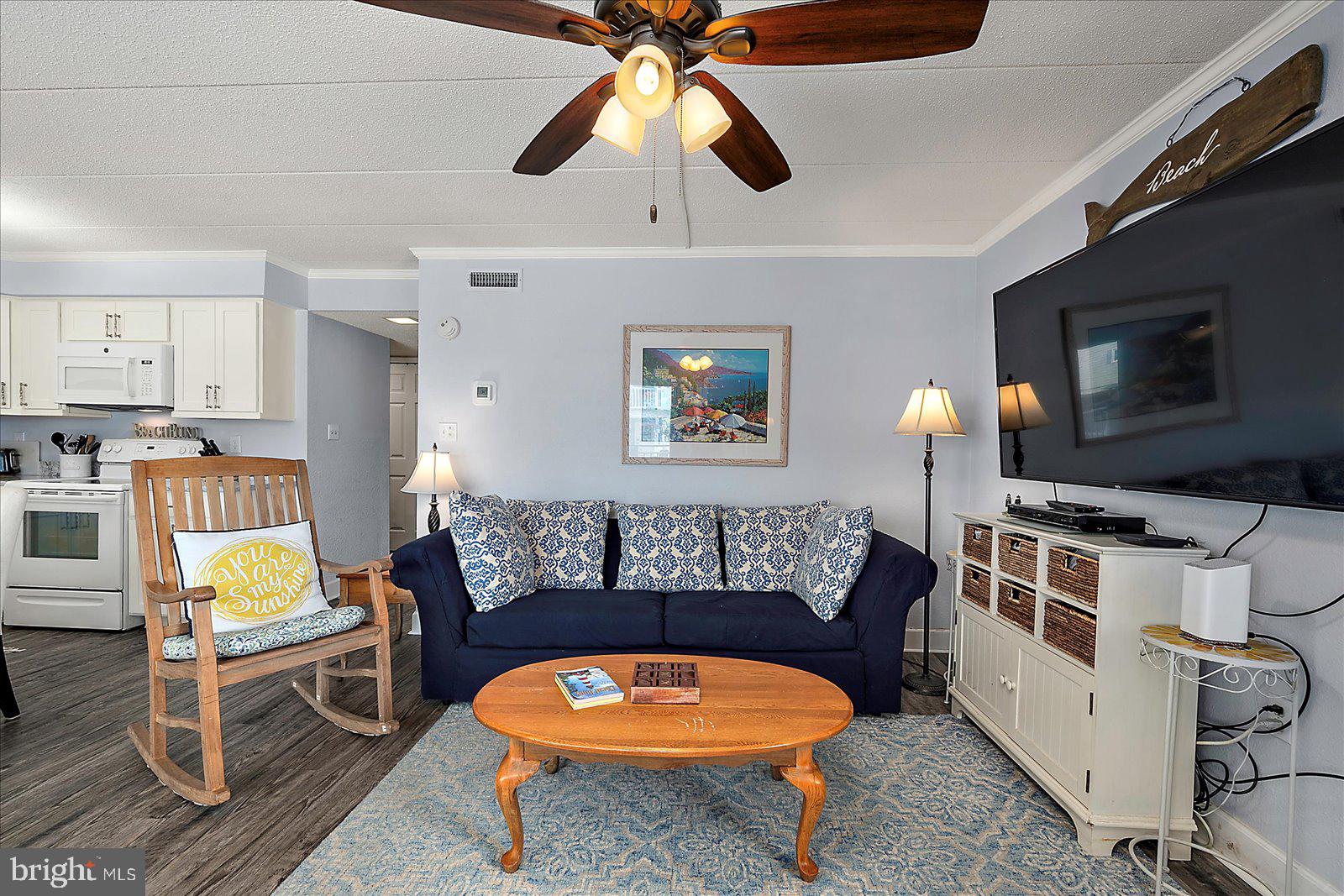 4 46th Street, Unit 101 Ocean City, MD 21842 - Photo 5 of 27 a living room with furniture and a flat screen tv