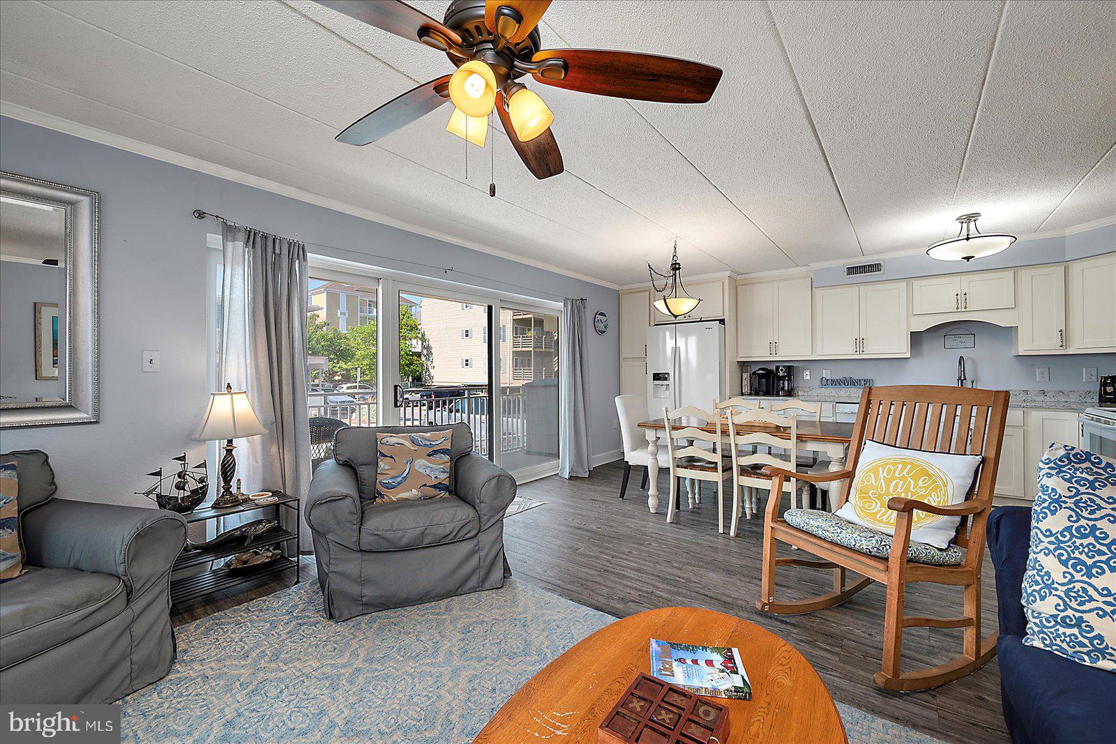 4 46th Street, Unit 101 Ocean City, MD 21842 - Photo 6 of 27 a living room with furniture and a large window