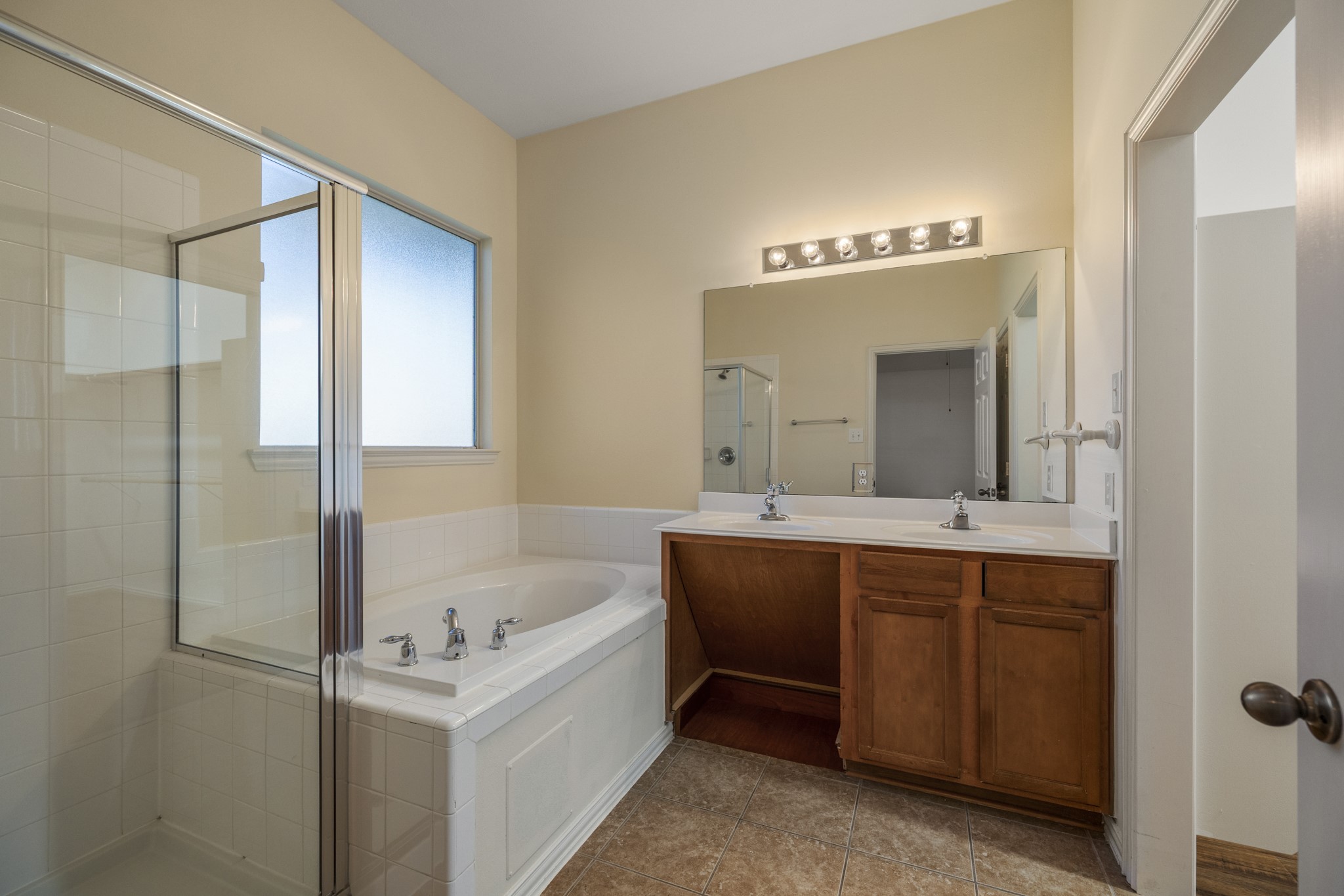 20014 Queens Oak Court Spring, TX 77379 - Photo 22 of 49 a bathroom with a tub sink and mirror