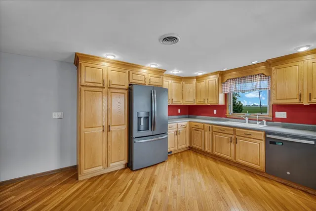 a living room with furniture and a ceiling fan