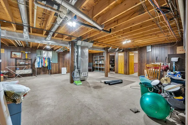 a view of a livingroom with furniture and a table chair