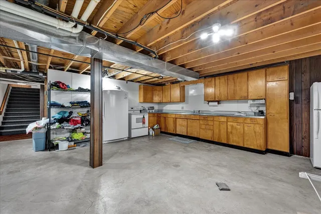 a view of a hardwood & staircase in a room