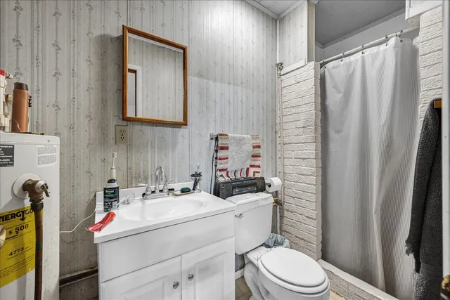 a living room with furniture rug and a floor to ceiling window