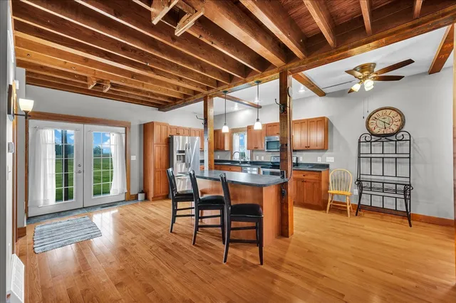 a view of a house with a yard and garage