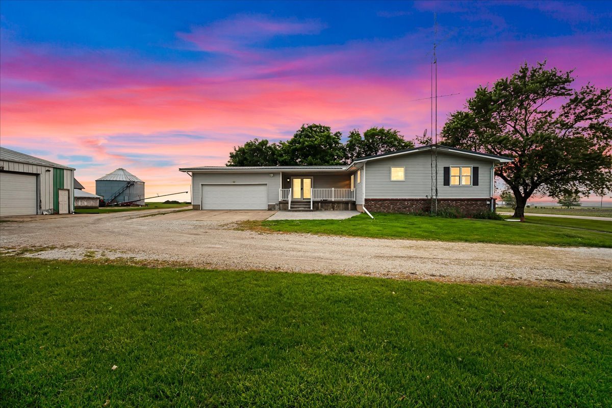 708 North 1950th Road Tonica, IL 61370 - Photo 4 of 95 a front view of a house with a garden