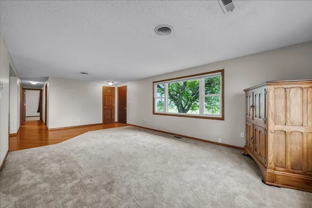 a kitchen with granite countertop a refrigerator and a sink
