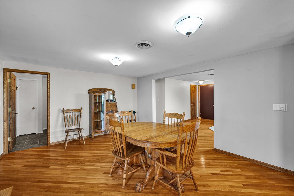 708 North 1950th Road Tonica, IL 61370 - Photo 10 of 95 a view of a dining room with furniture and wooden floor
