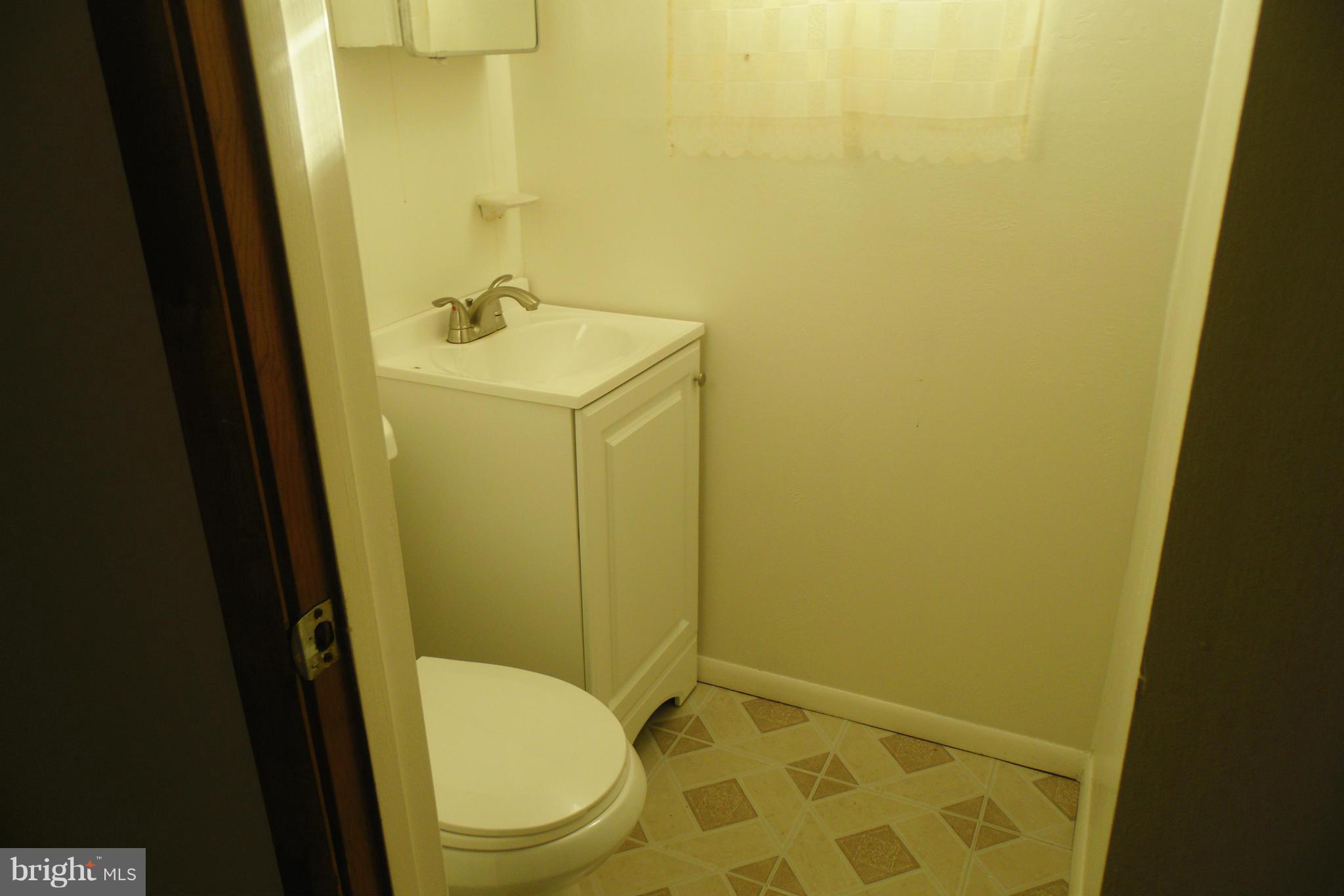 1303 Ray Road Hyattsville, MD 20782 - Photo 15 of 17 a bathroom with sink and mirror