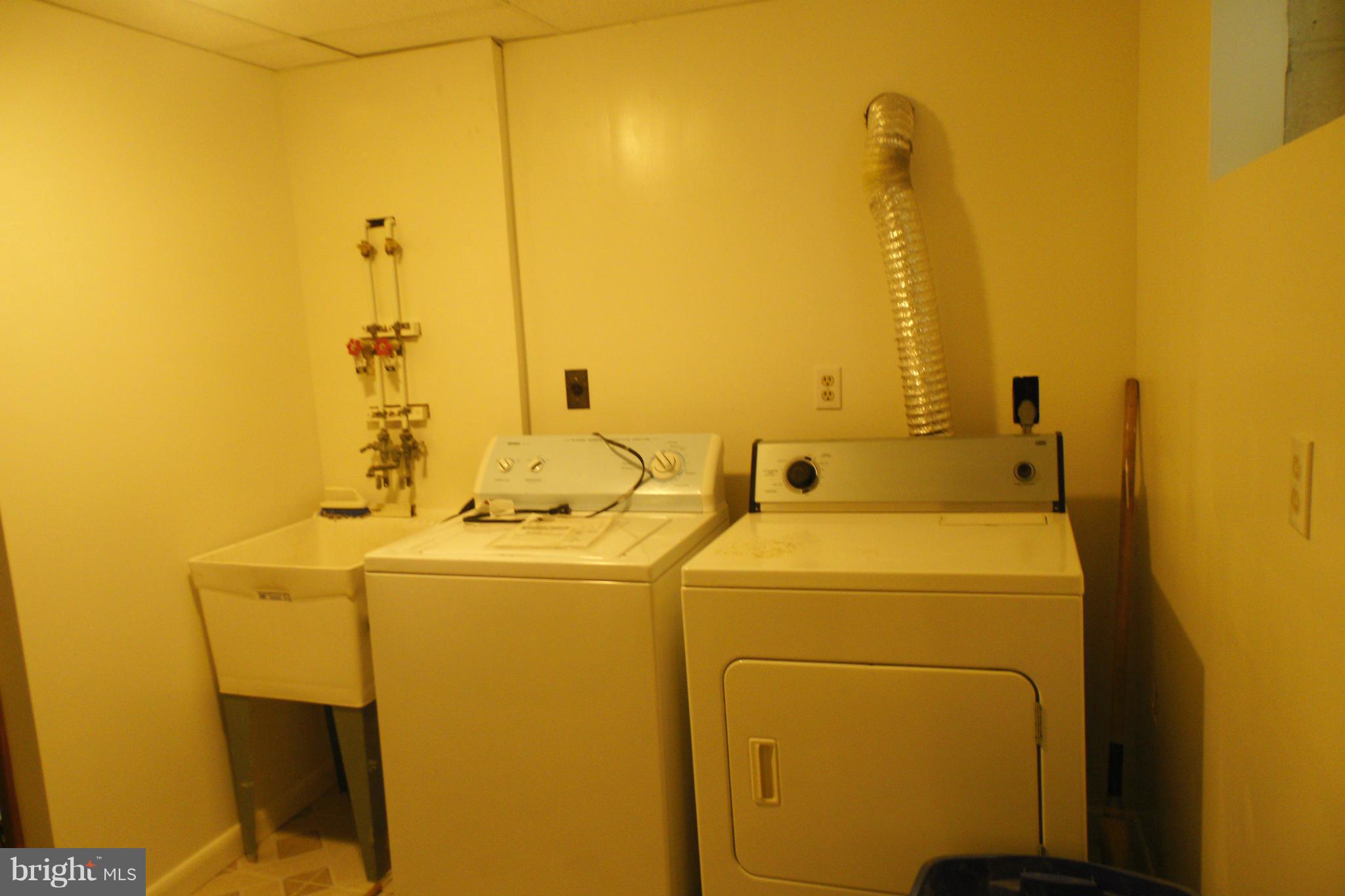 1303 Ray Road Hyattsville, MD 20782 - Photo 16 of 17 a utility room with dryer and washer