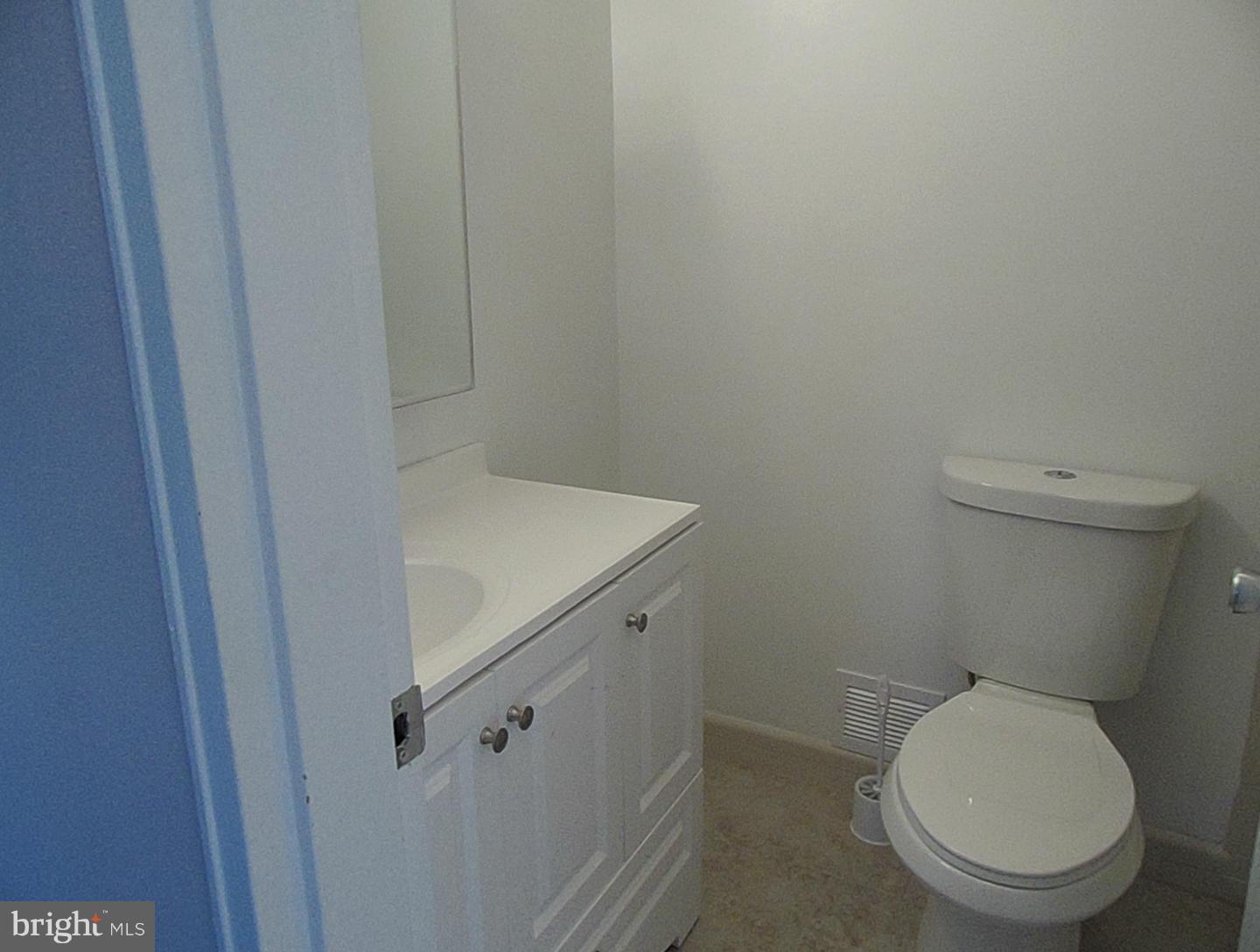 1303 Ray Road Hyattsville, MD 20782 - Photo 8 of 17 a white toilet sitting next to a sink