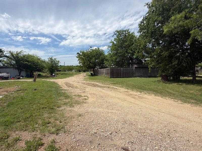 9300 Johns Road Alvarado, TX 76009 - Photo 10 of 40 a swimming pool with trees in the background