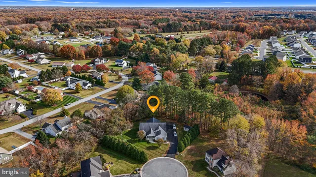 an aerial view of a house with a swimming pool