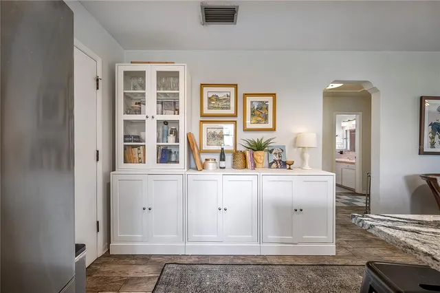 a kitchen with a stove and a refrigerator