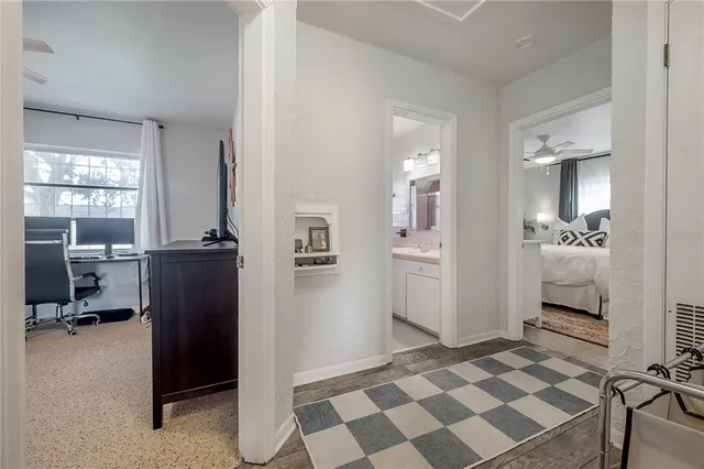 a bed room with a bed and a potted plant