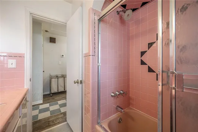 a living room with a bed and furniture