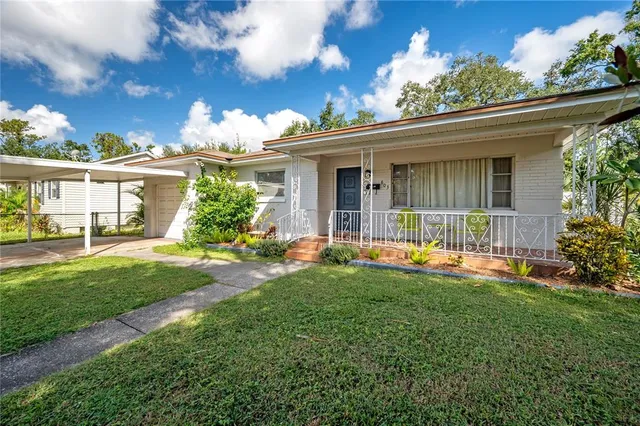 a front view of house with yard and green space
