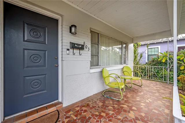 a swimming pool with outdoor seating and yard
