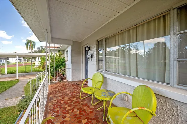 a view of a livingroom with furniture and a flat screen tv