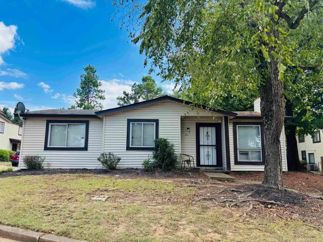 a house with trees in the background