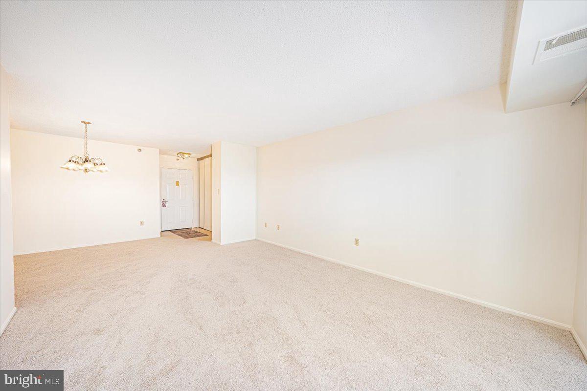 15101 Interlachen Drive, Unit 1807 Silver Spring, MD 20906 - Photo 19 of 50 a view of a room with an empty space