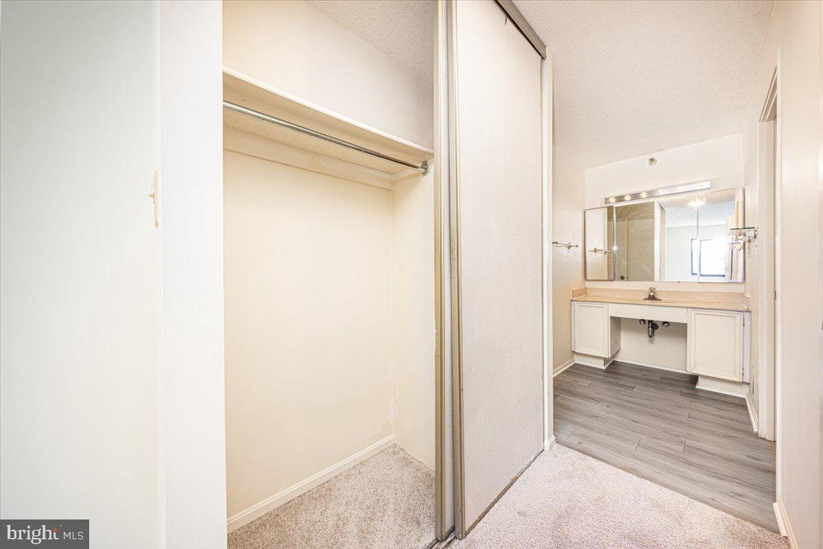 15101 Interlachen Drive, Unit 1807 Silver Spring, MD 20906 - Photo 35 of 50 a view of a bathroom from the hallway
