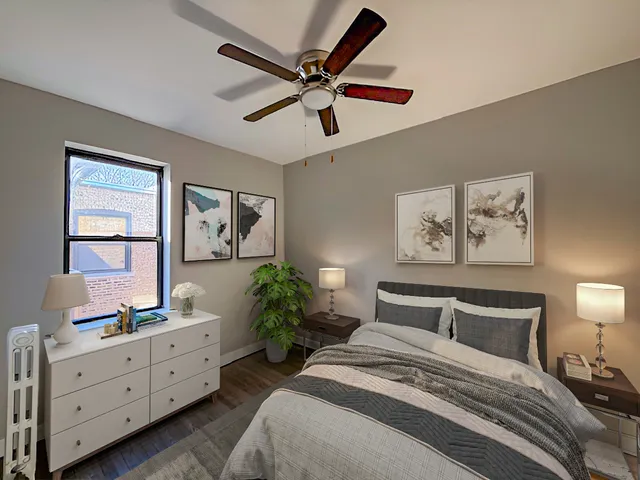a bedroom with bed painting on the wall and a window
