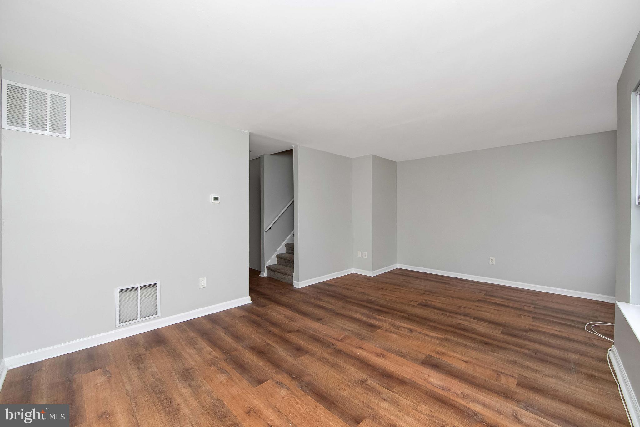 20 Gristmill Lane Pine Hill, NJ 08021 - Photo 16 of 37 a view of an empty room with wooden floor