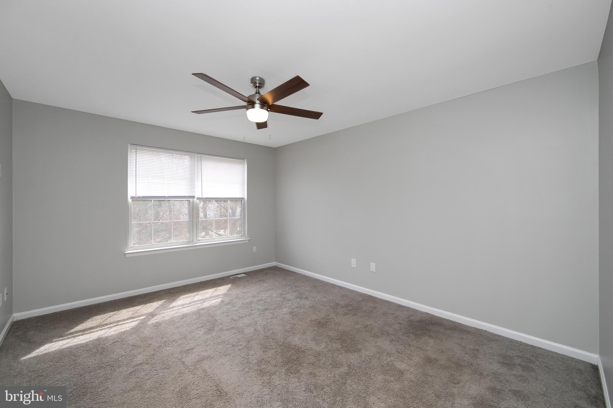 20 Gristmill Lane Pine Hill, NJ 08021 - Photo 18 of 37 an empty room with a window and a fan