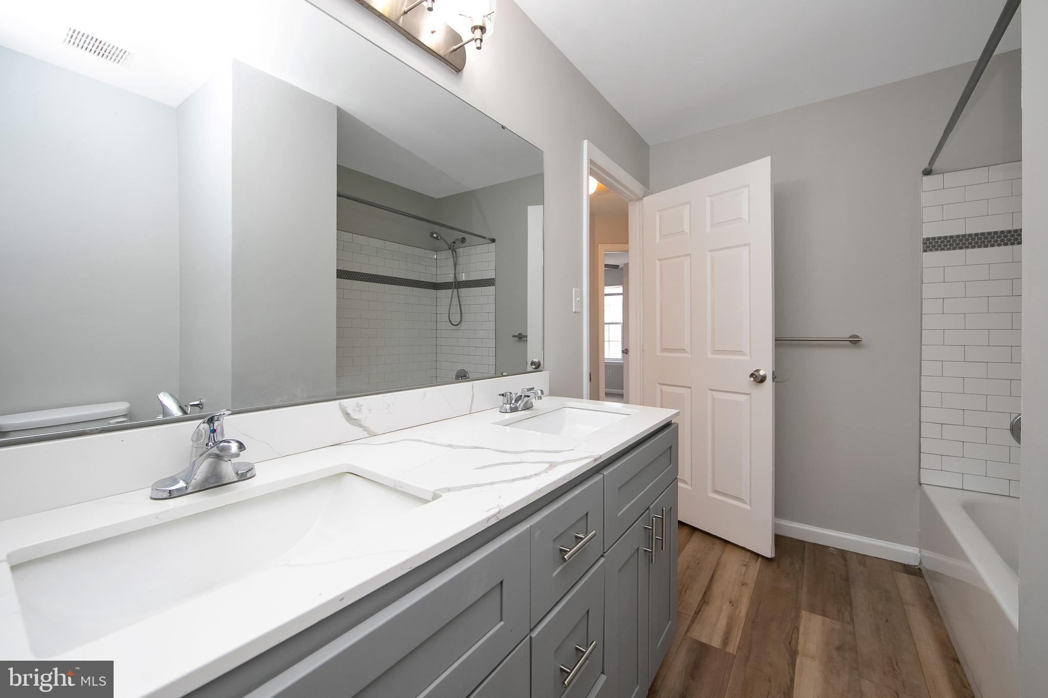 20 Gristmill Lane Pine Hill, NJ 08021 - Photo 23 of 37 a bathroom with a sink and a mirror