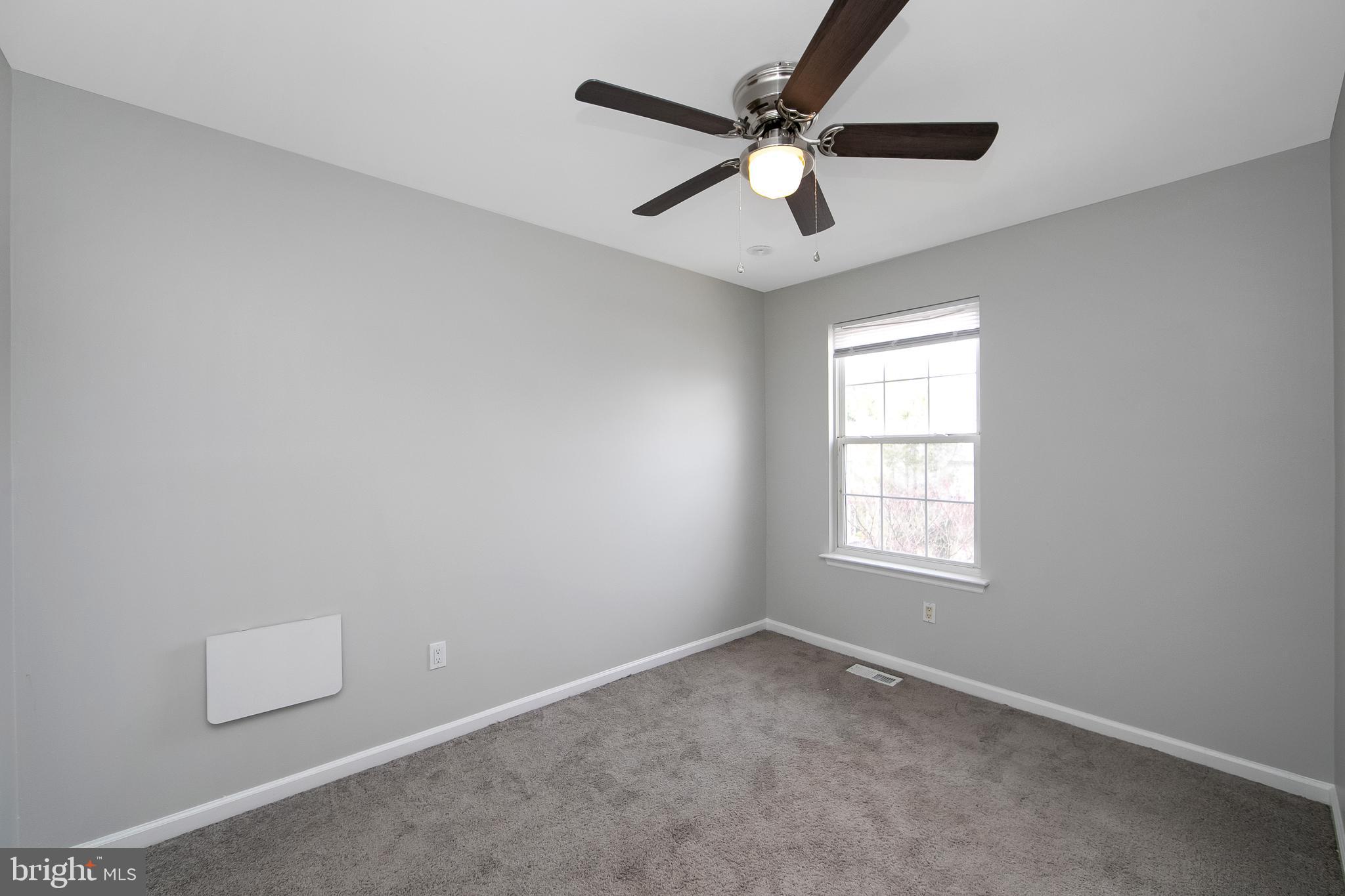 20 Gristmill Lane Pine Hill, NJ 08021 - Photo 26 of 37 an empty room with a window and a fan