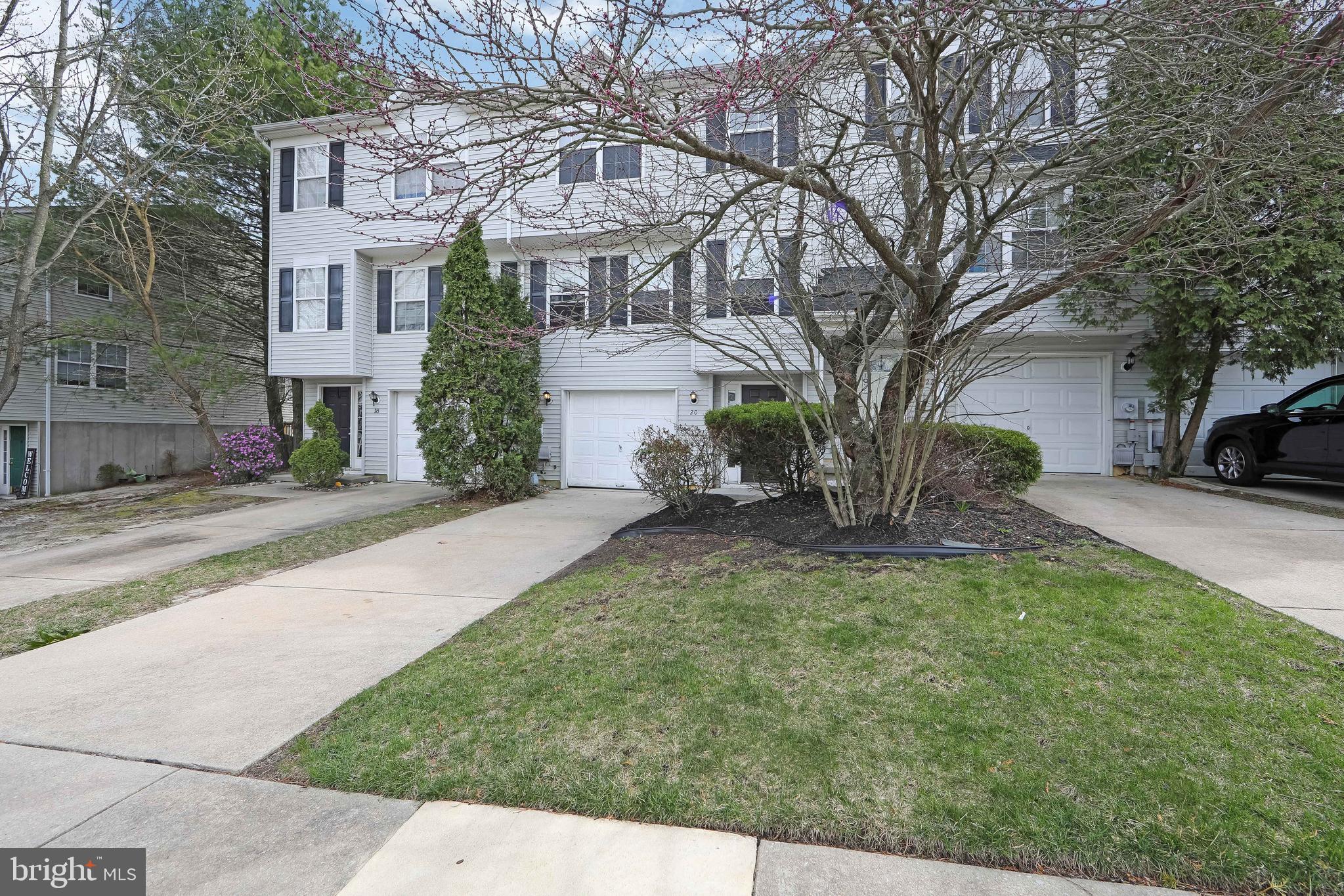 20 Gristmill Lane Pine Hill, NJ 08021 - Photo 3 of 37 a view of a yard in front of a brick house